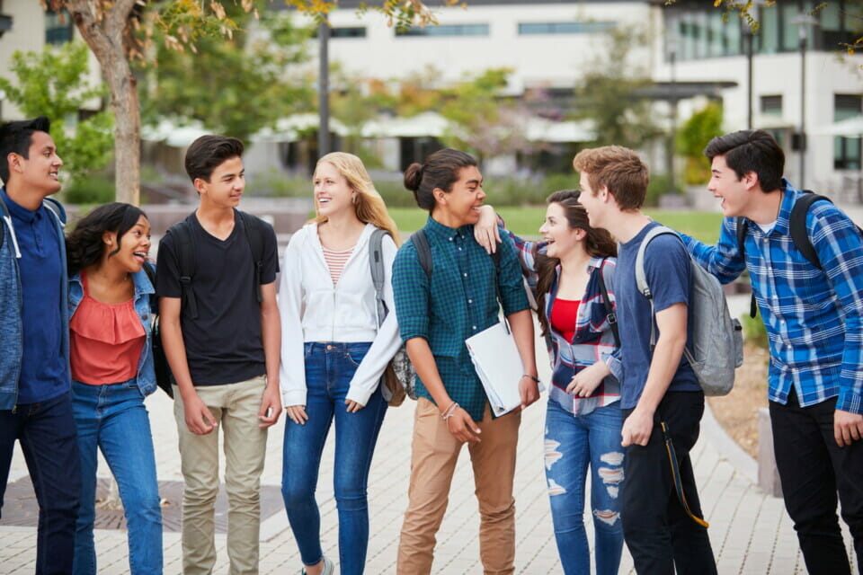high school students standing around chatting